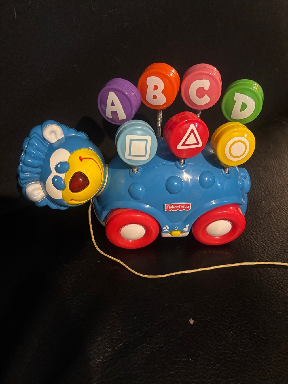 2001 Fisher-Price Blue Pull-Along Lion with Red Wheels and Colorful ABC Buttons